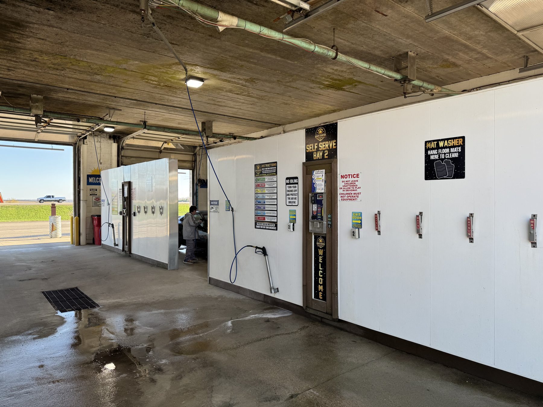 Customer washing a car in Self-Serve Bay 2